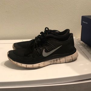 black nike athletic shoes